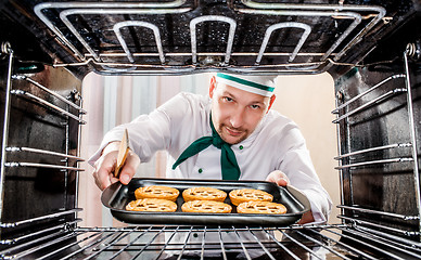 Image showing Chef cooking in the oven.