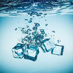 Image showing Ice cubes falling under water