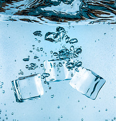 Image showing Ice cubes falling under water
