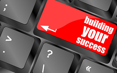 Image showing building your success words on button or key showing motivation for job or business