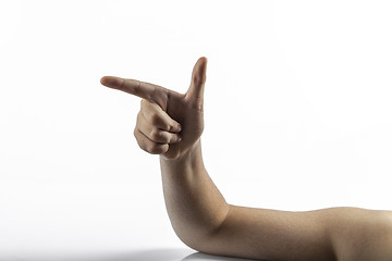 Image showing Young hands makes gun sign