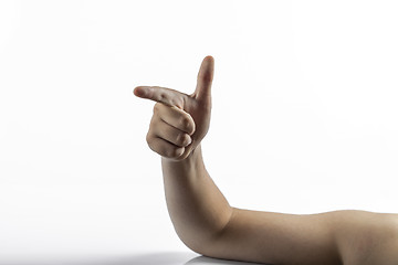 Image showing Young hands makes gun sign