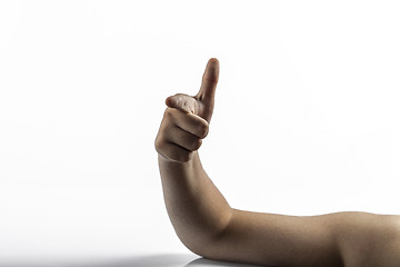 Image showing Young hands makes gun sign