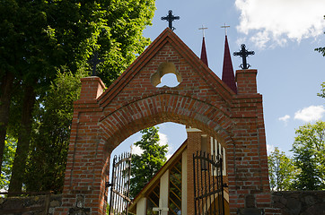 Image showing gothic church door with crosses in summer time 