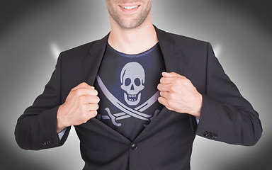 Image showing Businessman opening suit to reveal shirt with flag