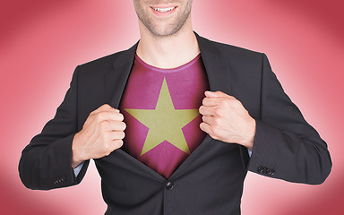 Image showing Businessman opening suit to reveal shirt with flag