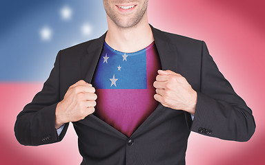 Image showing Businessman opening suit to reveal shirt with flag