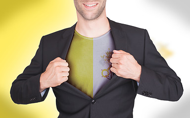 Image showing Businessman opening suit to reveal shirt with flag