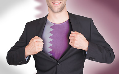 Image showing Businessman opening suit to reveal shirt with flag