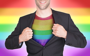 Image showing Businessman opening suit to reveal shirt with flag