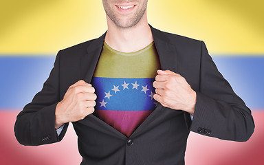 Image showing Businessman opening suit to reveal shirt with flag