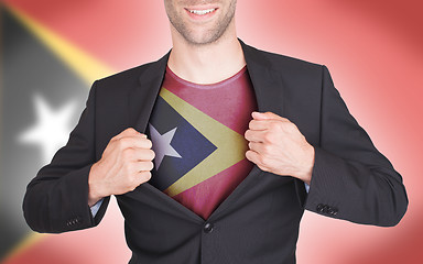 Image showing Businessman opening suit to reveal shirt with flag