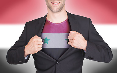 Image showing Businessman opening suit to reveal shirt with flag