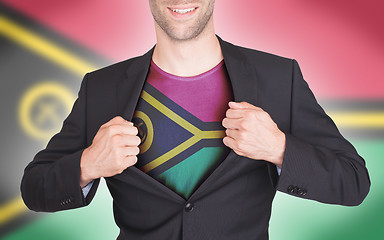 Image showing Businessman opening suit to reveal shirt with flag