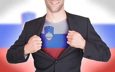 Image showing Businessman opening suit to reveal shirt with flag