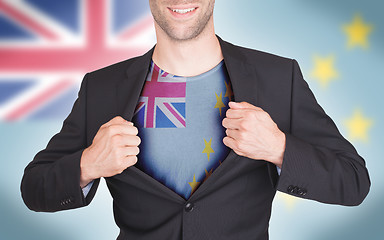 Image showing Businessman opening suit to reveal shirt with flag