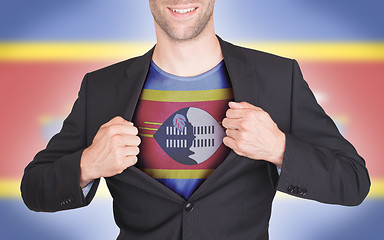 Image showing Businessman opening suit to reveal shirt with flag