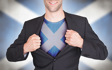 Image showing Businessman opening suit to reveal shirt with flag