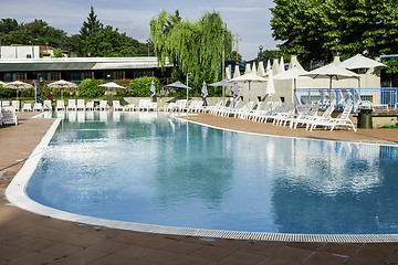 Image showing Pool and sun loungers