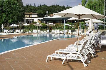 Image showing Pool and sun loungers