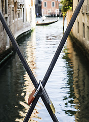 Image showing Padlocks of lovers placed on the bridge