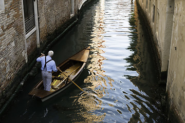 Image showing Man on a boat in Venice