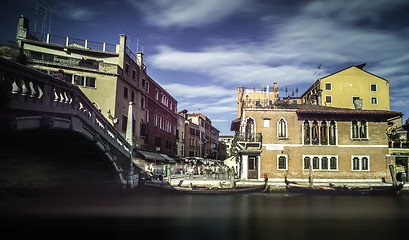 Image showing Ancient buildings and boats in the channel in Venice