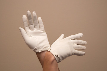 Image showing woman modeling formal vintage gloves with small buckles