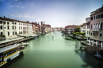 Image showing Ancient buildings and boats in the channel in Venice