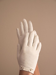 Image showing woman modeling vintage gloves with small buckles