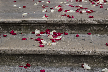 Image showing rose petals and rice grains on a staircase