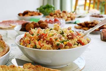 Image showing Bowl of rice salad on a buffet table