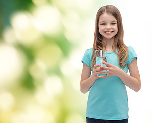 Image showing smiling little girl with glass of water