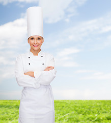 Image showing smiling female chef with crossed arms