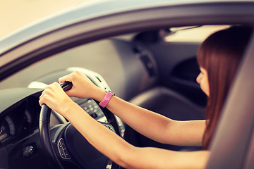 Image showing happy woman driving a car