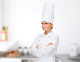 Image showing smiling female chef with crossed arms