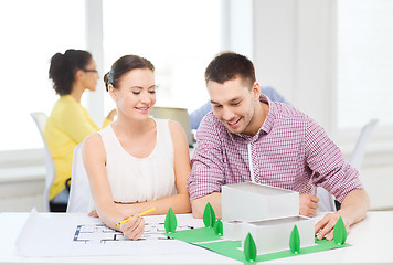 Image showing smiling architects working in office