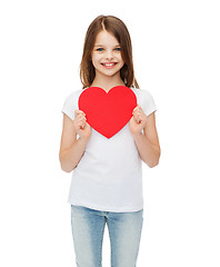 Image showing smiling little girl with red heart