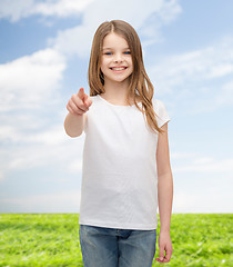 Image showing little girl in blank white t-shirt pointing at you