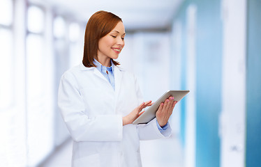 Image showing smiling female doctor and tablet pc computer