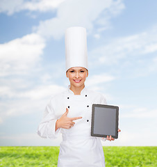 Image showing smiling female chef with tablet pc blank screen