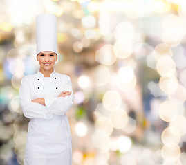 Image showing smiling female chef with crossed arms