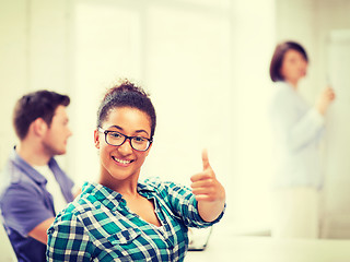 Image showing african student girl showing thumbs up