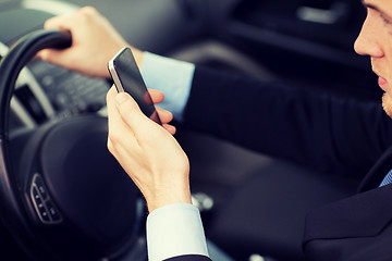 Image showing man using phone while driving the car