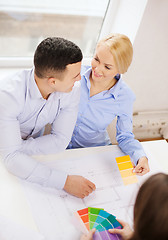 Image showing couple looking at blueprint and color samples