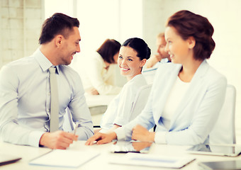 Image showing business team discussing something in office