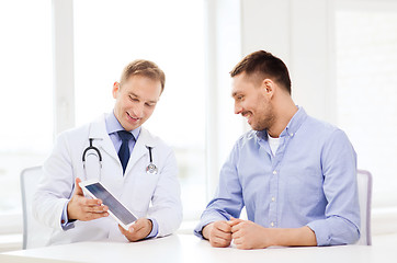 Image showing doctor with tablet pc and patient in hospital