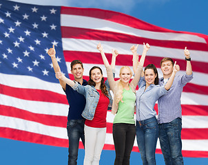 Image showing group of smiling students showing thumbs up