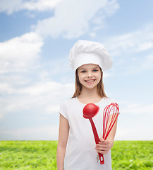 Image showing smiling girl in cook hat with ladle and whisk