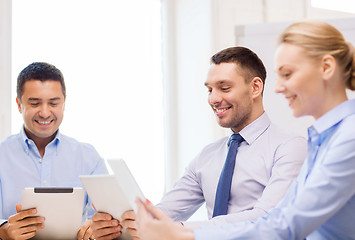 Image showing business team working with tablet pc in office